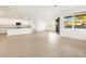 Bright and open living room with tan tile floors and ample natural light at 3598 E Alexander Dr, San Tan Valley, AZ 85143