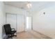 Carpeted bedroom featuring a ceiling fan, closet, and chair at 44922 W Alamendras St, Maricopa, AZ 85139