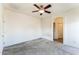 Carpeted bedroom featuring a ceiling fan, and lots of natural light at 44922 W Alamendras St, Maricopa, AZ 85139