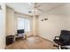 Bedroom with carpet, ceiling fan, and window offering natural light at 44922 W Alamendras St, Maricopa, AZ 85139