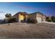 Charming single-story home with desert landscaping and a two-car garage on a sunny day at 44922 W Alamendras St, Maricopa, AZ 85139
