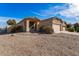 Charming single-story home with desert landscaping and a two-car garage on a sunny day at 44922 W Alamendras St, Maricopa, AZ 85139