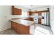 Functional kitchen with an island, ample counter space, cabinets, and modern appliances at 44922 W Alamendras St, Maricopa, AZ 85139