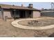Backyard featuring a fire pit, patio, and a storage shed at 4537 E Hidalgo Ave, Phoenix, AZ 85040