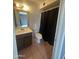 Cozy bathroom with a single sink vanity, toilet, and shower at 4537 E Hidalgo Ave, Phoenix, AZ 85040