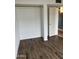 Bedroom featuring a closet and hardwood floors at 4537 E Hidalgo Ave, Phoenix, AZ 85040