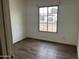 Bright bedroom featuring hardwood floors and a window bringing in lots of natural light at 4537 E Hidalgo Ave, Phoenix, AZ 85040