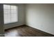 Bedroom with dark hardwood floors and great natural light at 4537 E Hidalgo Ave, Phoenix, AZ 85040