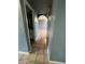 Neutral hallway with tile flooring leading to a bathroom and other areas of the home at 4537 E Hidalgo Ave, Phoenix, AZ 85040