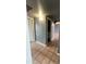 Hallway featuring tile floors and neutral walls, connecting various rooms in the house at 4537 E Hidalgo Ave, Phoenix, AZ 85040