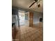 Kitchen featuring a stainless steel refrigerator and view to fenced front yard at 4537 E Hidalgo Ave, Phoenix, AZ 85040