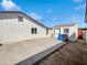 Backyard featuring a white shed, partial concrete patio, and side of house at 4644 E Southern Ave, Phoenix, AZ 85042