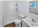 Clean bathroom featuring a modern sink, toilet, and shower with bright, white walls and a wood-style floor at 4644 E Southern Ave, Phoenix, AZ 85042