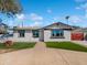 Charming single-story home with well-maintained lawn and inviting curb appeal on a beautiful sunny day at 4644 E Southern Ave, Phoenix, AZ 85042