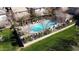Aerial view of the community pool, nestled amongst greenery and homes, providing a serene recreational space at 4744 E Tierra Buena Ln, Phoenix, AZ 85032