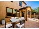 Comfortable back patio with an outdoor dining area with ample space for entertaining guests at 4744 E Tierra Buena Ln, Phoenix, AZ 85032