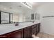 Bathroom with double sink vanity, modern fixtures, and ample mirror space at 4744 E Tierra Buena Ln, Phoenix, AZ 85032