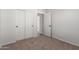 Bedroom featuring closet with sliding doors, doorway, and electrical outlets at 4744 E Tierra Buena Ln, Phoenix, AZ 85032
