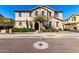 Inviting two-story stucco home with manicured front yard and decorative architectural details at 4744 E Tierra Buena Ln, Phoenix, AZ 85032