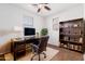 Inviting home office featuring a sleek desk, comfortable chair, and ample storage with a well-lit, neutral color palette at 4744 E Tierra Buena Ln, Phoenix, AZ 85032