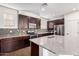 Well-equipped kitchen with stainless steel appliances, granite countertops, and ample cabinet space at 4744 E Tierra Buena Ln, Phoenix, AZ 85032