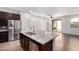 Spacious kitchen with an island, stainless steel appliances, and a view of the backyard at 4744 E Tierra Buena Ln, Phoenix, AZ 85032