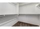 Spacious walk-in closet featuring ample shelving and clothing rods, perfect for maximizing storage at 4744 E Tierra Buena Ln, Phoenix, AZ 85032