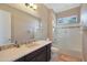 Bright bathroom with a decorative vanity, a large mirror, and a separate shower and tub for ultimate relaxation at 5090 S Pinaleno Pl, Chandler, AZ 85249