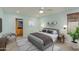 Cozy bedroom featuring a plush bed, soft lighting, and a decorative plant at 5333 N Las Casitas Pl, Phoenix, AZ 85016