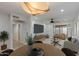 Open dining area with natural light, modern decor, and seamless flow to the living room at 5333 N Las Casitas Pl, Phoenix, AZ 85016