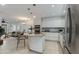 Modern kitchen featuring an island, stainless steel appliances, and sleek white cabinetry at 5333 N Las Casitas Pl, Phoenix, AZ 85016