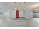 Spacious kitchen island with granite countertops and modern pendant lighting at 5333 N Las Casitas Pl, Phoenix, AZ 85016