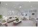 Bright living room featuring neutral color palette, modern décor, and a ceiling fan at 5333 N Las Casitas Pl, Phoenix, AZ 85016