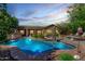 Beautiful backyard with a sparkling pool and covered patio, perfect for entertaining at 5523 W Yearling Rd, Phoenix, AZ 85083