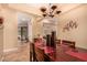 Dining area featuring an elegant chandelier and views to the billiard and outdoor spaces at 5523 W Yearling Rd, Phoenix, AZ 85083