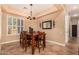 Dining room with seating for six and natural lighting from window with shutters at 5523 W Yearling Rd, Phoenix, AZ 85083