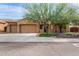 Charming home featuring a three car garage, desert landscaping, and a cozy front porch at 5523 W Yearling Rd, Phoenix, AZ 85083
