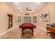 Well-lit game room featuring a pool table, billiard sign, and stylish decor at 5523 W Yearling Rd, Phoenix, AZ 85083