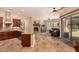 Open concept floor plan features a modern kitchen with stainless steel appliances and a fireplace at 5523 W Yearling Rd, Phoenix, AZ 85083