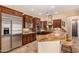 Gourmet kitchen with stainless steel appliances, granite countertops, and custom cabinets at 5523 W Yearling Rd, Phoenix, AZ 85083