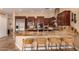 Modern kitchen features stainless appliances, dark wood cabinets, and granite countertops at 5523 W Yearling Rd, Phoenix, AZ 85083