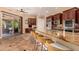 Spacious kitchen with granite counters, stainless appliances, and barstool seating at 5523 W Yearling Rd, Phoenix, AZ 85083