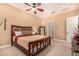 Comfortable bedroom with a decorative headboard, neutral color scheme, and ample lighting at 5523 W Yearling Rd, Phoenix, AZ 85083