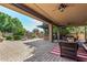 Expansive covered patio featuring a built-in BBQ area, a pool, and ample seating at 5523 W Yearling Rd, Phoenix, AZ 85083