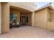 Inviting outdoor patio space with brick flooring and cozy seating area at 5523 W Yearling Rd, Phoenix, AZ 85083