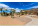 Inviting community playground with covered areas, various climbing structures, swings, and open space for fun and activities at 5523 W Yearling Rd, Phoenix, AZ 85083