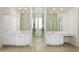 Elegant bathroom with double vanity, mirrors, ample storage and a glass block shower at 5892 E Evening Glow Dr, Scottsdale, AZ 85266