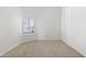 Sun-filled empty bedroom with neutral carpet and plantation shutters at 5892 E Evening Glow Dr, Scottsdale, AZ 85266