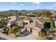 Stunning desert home with neutral tones, lush landscaping, and mountain views at 5892 E Evening Glow Dr, Scottsdale, AZ 85266