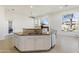 Large kitchen island with bar seating and stainless steel appliances, perfect for food preparation and dining at 5892 E Evening Glow Dr, Scottsdale, AZ 85266